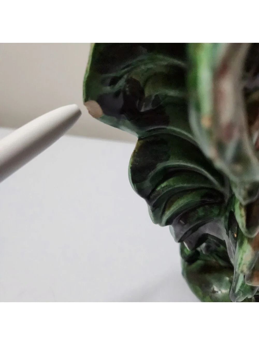 Green ceramic rooster figurine